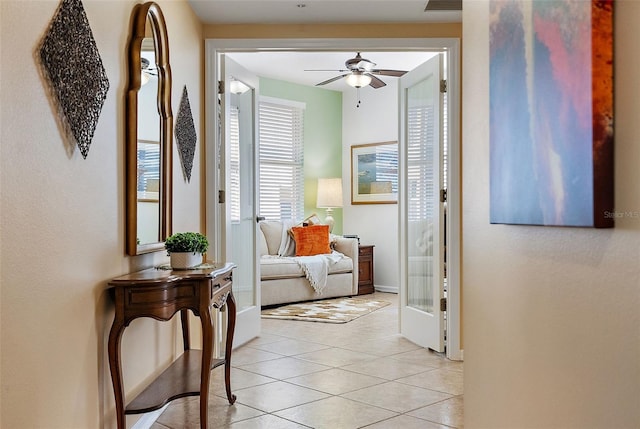 hallway featuring light tile patterned floors