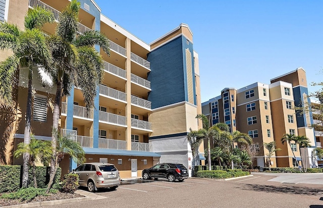 view of property featuring uncovered parking