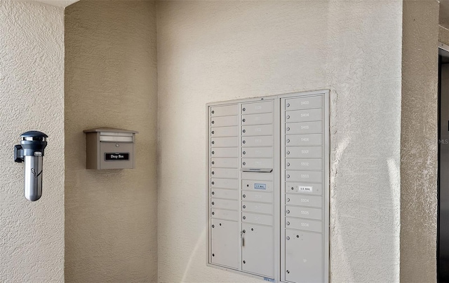 details with stucco siding and mail area