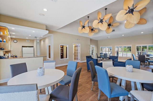 dining area with recessed lighting, baseboards, wood finished floors, and a ceiling fan