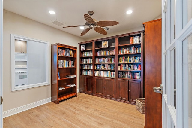 interior space featuring a ceiling fan, recessed lighting, light wood-style floors, and visible vents