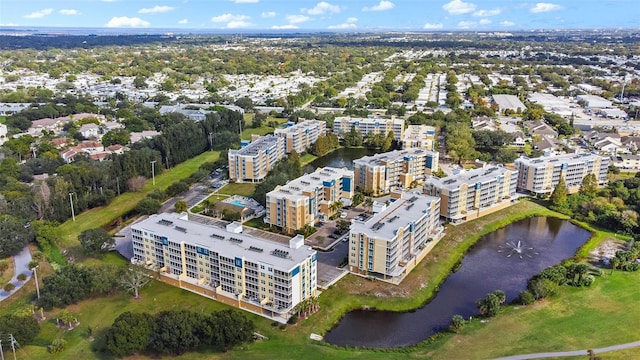 drone / aerial view with a view of city and a water view