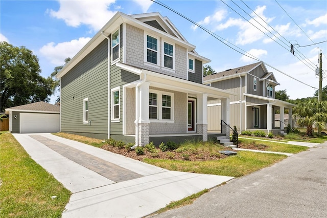 408 W Paris St, Tampa, FL 33604 - view of front facade with covered porch, an outdoor structure, and a detached garage