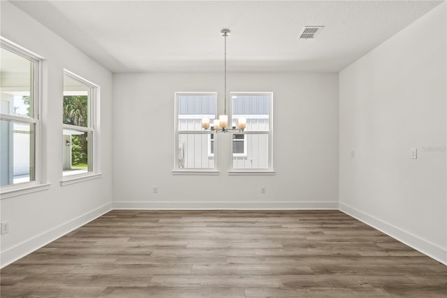 408 W Paris St, Tampa, FL 33604 - unfurnished dining area with a chandelier and wood finished floors