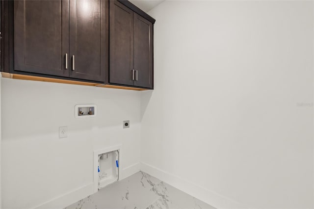 408 W Paris St, Tampa, FL 33604 - laundry area featuring cabinet space, hookup for an electric dryer, light marble finish flooring, and hookup for a washing machine