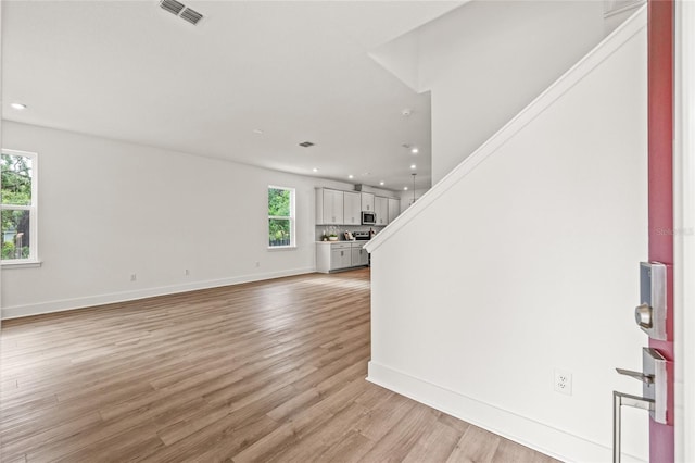408 W Paris St, Tampa, FL 33604 - entryway featuring recessed lighting, light wood-type flooring, and stairs