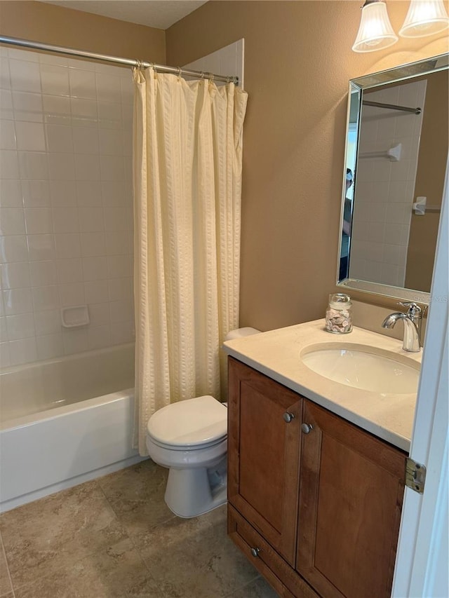 full bathroom featuring shower / tub combo, vanity, and toilet