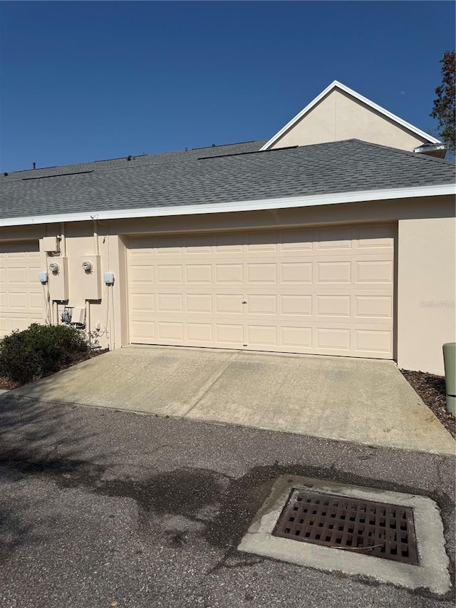 garage featuring driveway