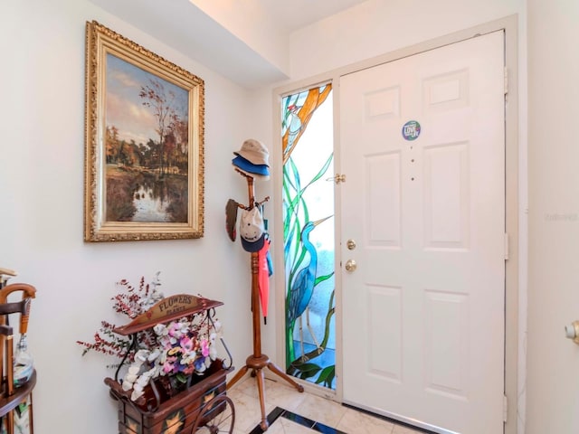 foyer entrance featuring light tile patterned floors