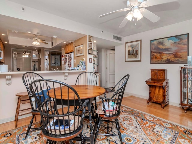 dining area with light wood-type flooring, visible vents, recessed lighting, baseboards, and ceiling fan