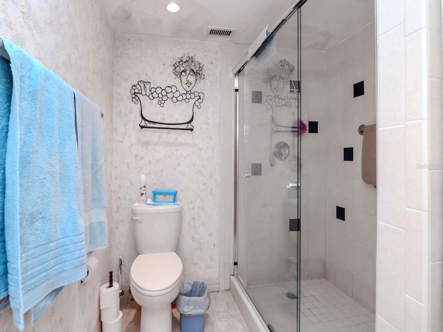 bathroom with visible vents, toilet, and a shower stall