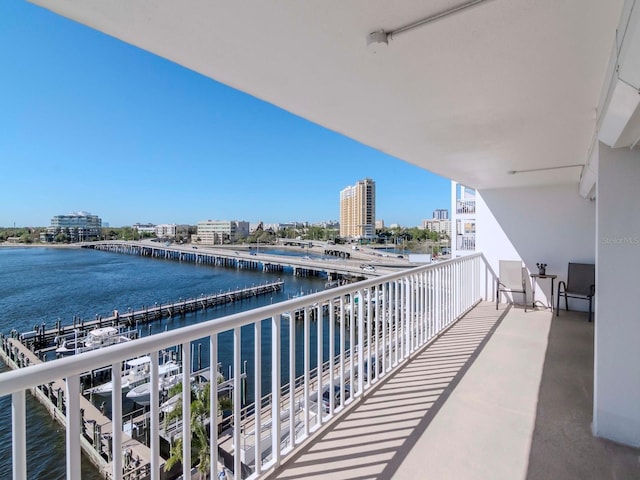 balcony featuring a view of city and a water view