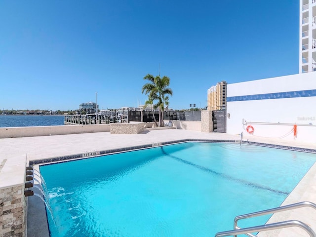 community pool with a patio area