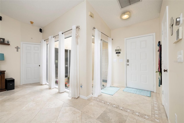 entrance foyer featuring visible vents and baseboards