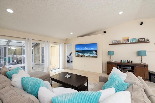 living room with recessed lighting, a textured ceiling, lofted ceiling, and a sunroom