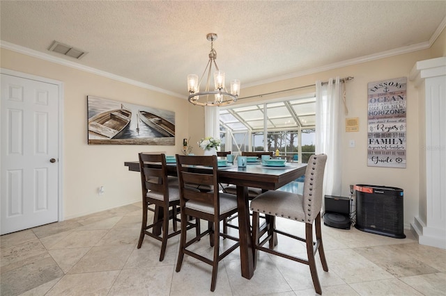 dining room featuring visible vents, a textured ceiling, baseboards, and ornamental molding