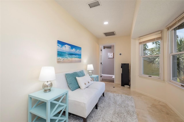 sitting room with baseboards and visible vents