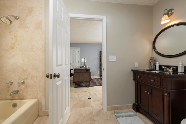 full bath featuring a textured ceiling, vanity, tile patterned flooring, baseboards, and shower / bathtub combination