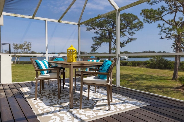 wooden deck with glass enclosure and a yard