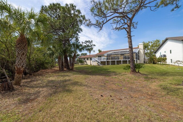 view of yard with a lanai