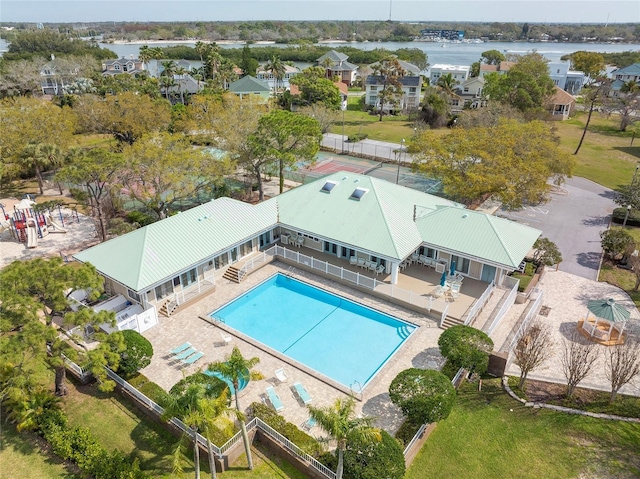 bird's eye view featuring a water view and a residential view