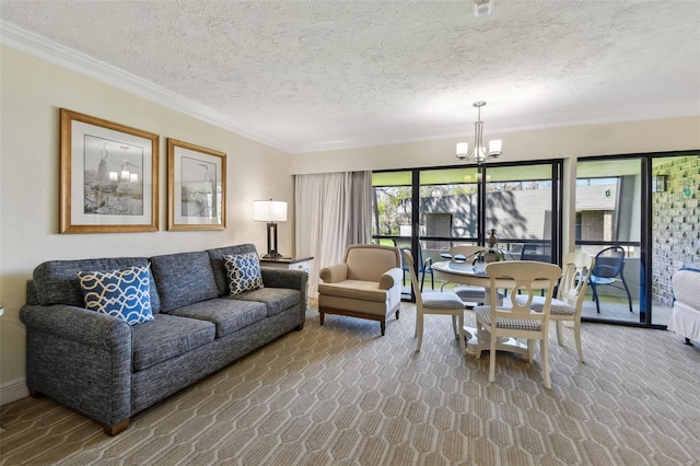 carpeted living area featuring a textured ceiling, ornamental molding, and a notable chandelier