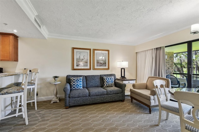 living room with crown molding, a textured ceiling, and baseboards