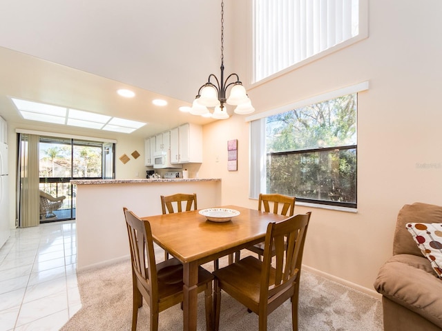 dining space with light tile patterned floors, baseboards, light colored carpet, and recessed lighting