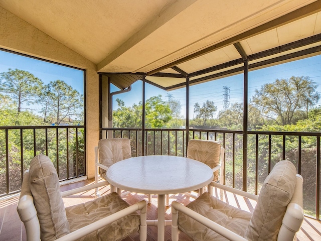 sunroom with vaulted ceiling