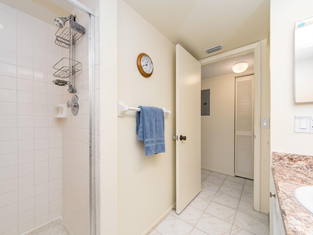 bathroom featuring vanity, visible vents, electric panel, a stall shower, and marble finish floor