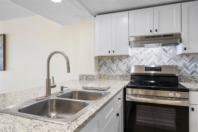 kitchen with stainless steel electric stove, under cabinet range hood, a sink, and white cabinetry