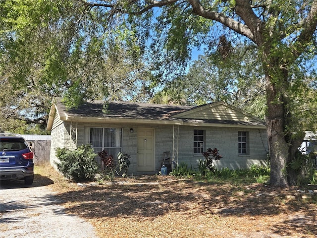 ranch-style home featuring driveway