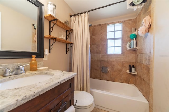 full bath with vanity, toilet, and shower / bath combo with shower curtain