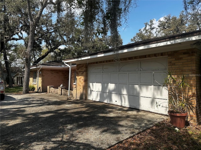 garage with aphalt driveway