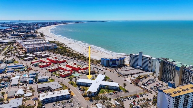 birds eye view of property with a city view, a view of the beach, and a water view