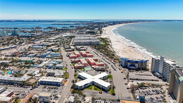 drone / aerial view with a beach view and a water view