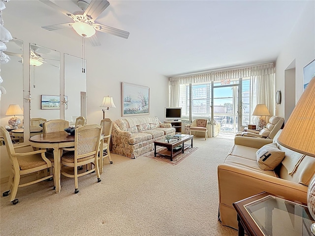 living room with carpet flooring and ceiling fan