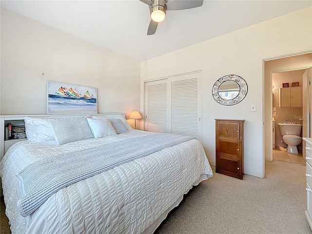 bedroom featuring ceiling fan, a closet, and light carpet