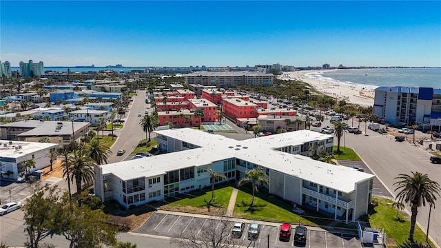 birds eye view of property featuring a view of city and a water view