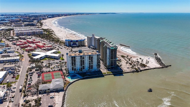 bird's eye view with a water view, a city view, and a beach view