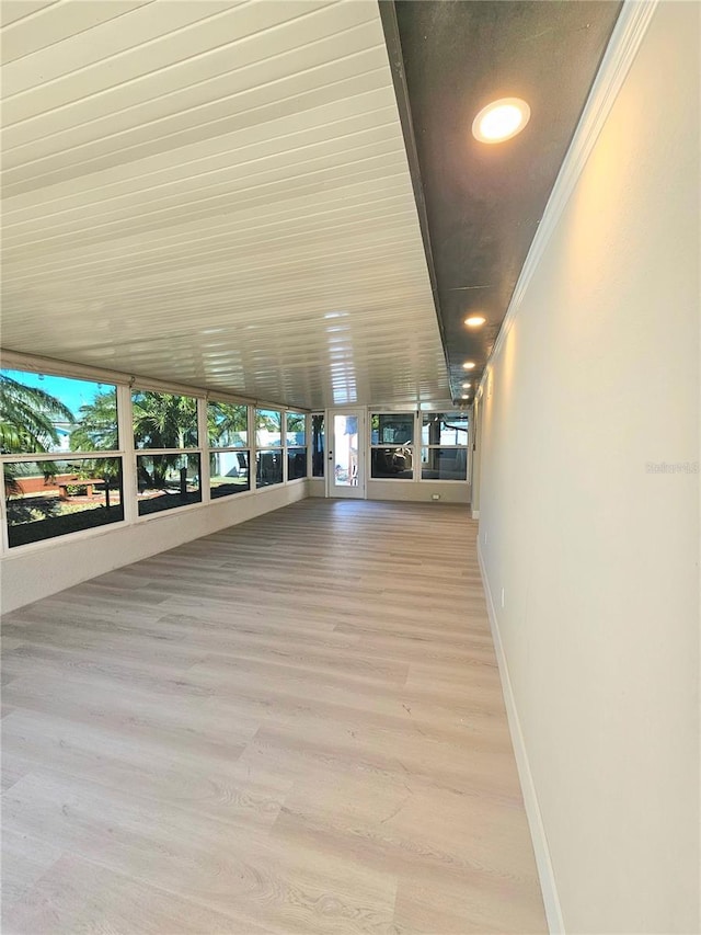 13633 Britton Dr, Hudson, FL 34667 - interior space featuring crown molding, baseboards, and wood finished floors