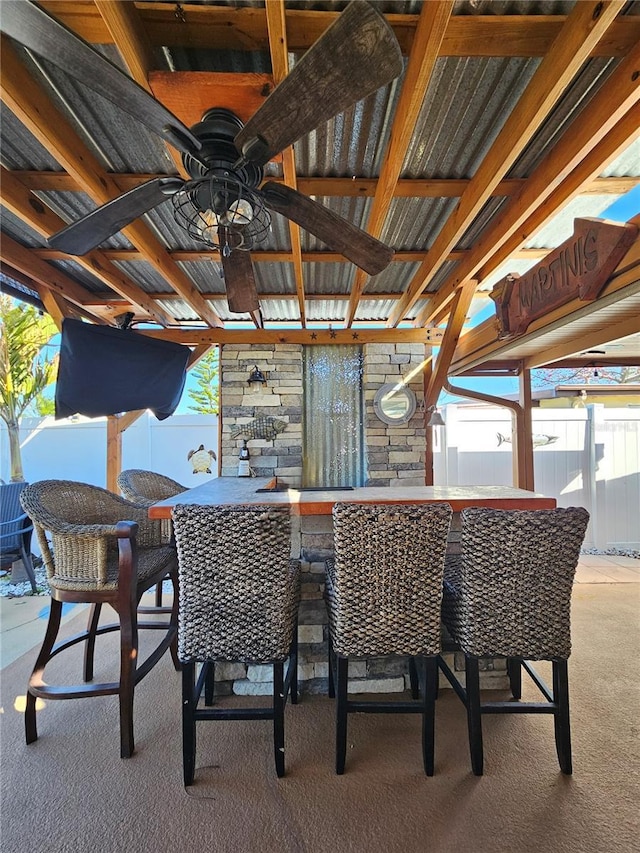 13633 Britton Dr, Hudson, FL 34667 - exterior space featuring outdoor dry bar, fence, and ceiling fan