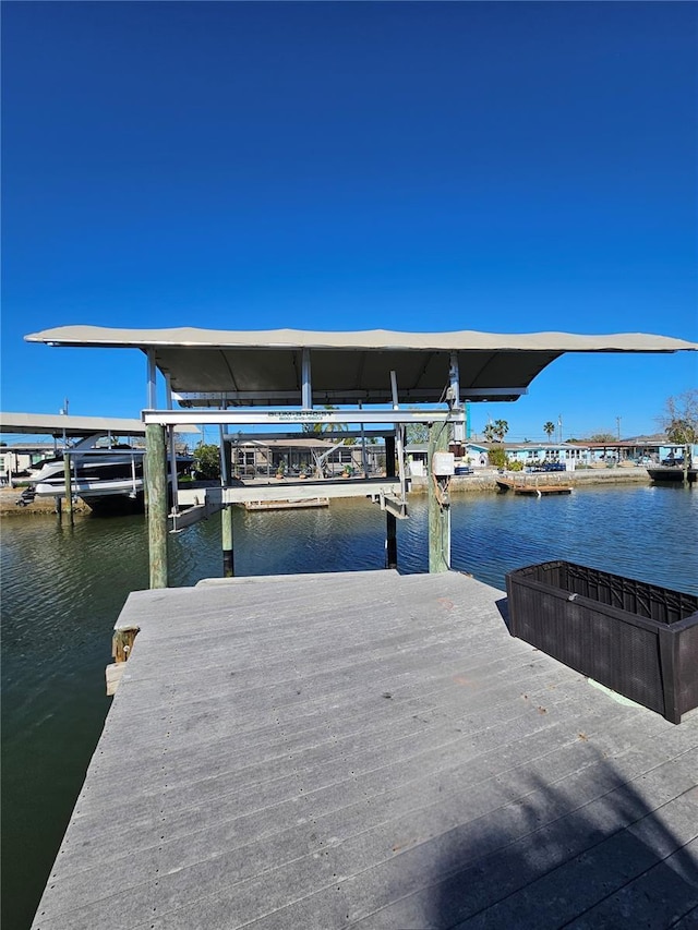 13633 Britton Dr, Hudson, FL 34667 - dock area featuring a water view and boat lift