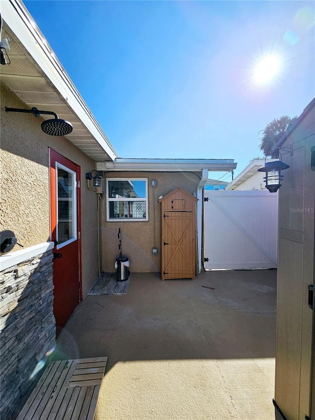 13633 Britton Dr, Hudson, FL 34667 - view of patio / terrace featuring fence and a gate