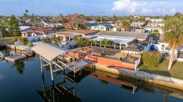 13633 Britton Dr, Hudson, FL 34667 - view of dock with a water view, a residential view, and boat lift