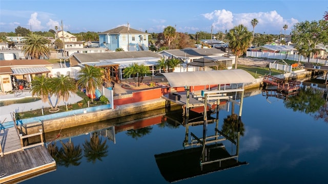 13633 Britton Dr, Hudson, FL 34667 - dock area featuring a water view, a residential view, and boat lift