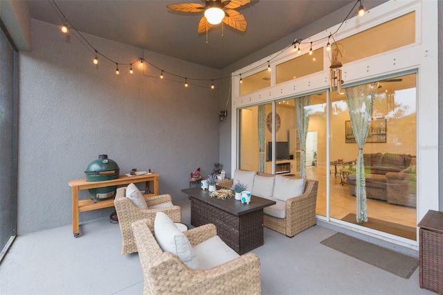 view of patio / terrace with an outdoor living space and ceiling fan