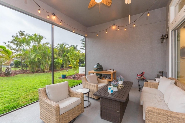 view of patio featuring a ceiling fan, outdoor lounge area, and fence