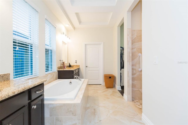 bathroom with a garden tub, a spacious closet, vanity, and a tile shower