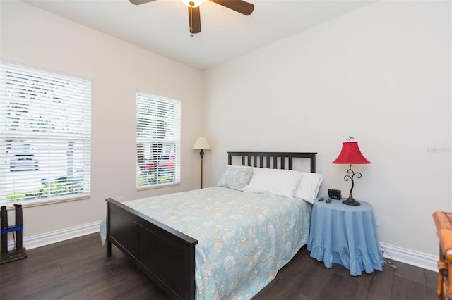 bedroom with wood finished floors, baseboards, and ceiling fan